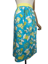 Load image into Gallery viewer, Original 1950's Novelty Print Cotton Apron with Sewing Theme in Blue, Yellow and Green - Waist 38 40
