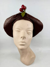 Load image into Gallery viewer, Original 1920's Brown Lacquered Straw Cloche with Upturned Brim and Cherry Trim *