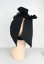 Load image into Gallery viewer, Original 1940’s Black Topper Hat with Pastel Flowers in Pink, Purple and Blue and Huge Bow Trim *