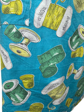 Load image into Gallery viewer, Original 1950's Novelty Print Cotton Apron with Sewing Theme in Blue, Yellow and Green - Waist 38 40