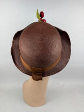 Load image into Gallery viewer, Original 1920's Brown Lacquered Straw Cloche with Upturned Brim and Cherry Trim *