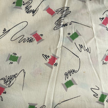 Load image into Gallery viewer, Original 1940’s Novelty Print Cotton Dress Fabric in Buttermilk with Cotton Reels in Pink and Green and Black Sewing Needles and Thread
