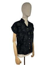 Load image into Gallery viewer, Original 1950’s Black Artificial Silk Blouse with Silver and Gold Glitter Floral Print and Glass Buttons - Bust 36 *