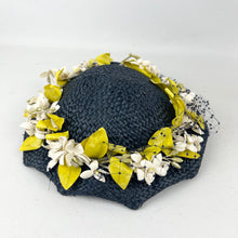 Load image into Gallery viewer, Original 1950’s Lacquered Raffia Hat with Flower Trim and Net in Navy, White and Yellow