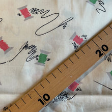 Load image into Gallery viewer, Original 1940’s Novelty Print Cotton Dress Fabric in Buttermilk with Cotton Reels in Pink and Green and Black Sewing Needles and Thread