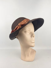 Load image into Gallery viewer, Original 1930s Brown Straw Cloche Hat with Rust Coloured Polka Dot Ribbon Trim and Metal Feather Trim