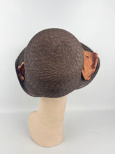Load image into Gallery viewer, Original 1930s Brown Straw Cloche Hat with Rust Coloured Polka Dot Ribbon Trim and Metal Feather Trim
