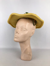 Load image into Gallery viewer, Original 1940s or 1950s Yellow Straw Hat with Wavy Brim and White and Green Floral Trim
