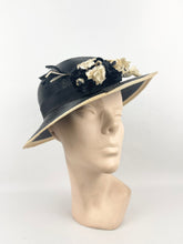Load image into Gallery viewer, Original 1930s Black and Cream Lacquered Straw Hat with Velvet Floral Trim