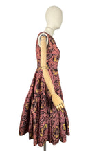 Load image into Gallery viewer, Original 1950&#39;s Salmon Pink Grosgrain Full Circle Day Dress with Bold Floral in Yellow, White and Black Flock - Bust 36
