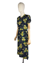 Load image into Gallery viewer, Original 1940's Navy Day Dress with Double Peplum and Floral Print in Green and Yellow - Bust 34 35
