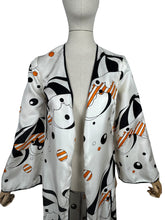 Load image into Gallery viewer, Original Vintage 1960&#39;s 1970&#39;s White, Black and Orange Robe with Novelty Umbrella Print - Bust 34 36
