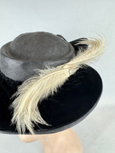 Load image into Gallery viewer, Original Early 20th Century Black Straw Hat with Velvet Covered Brim and Ivory Coloured Feather Trim *
