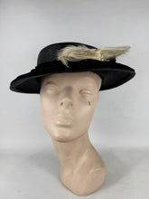 Load image into Gallery viewer, Original Early 20th Century Black Straw Hat with Velvet Covered Brim and Ivory Coloured Feather Trim *
