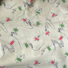 Load image into Gallery viewer, Original 1940’s Novelty Print Cotton Dress Fabric in Buttermilk with Cotton Reels in Pink and Green and Black Sewing Needles and Thread
