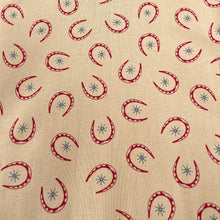 Load image into Gallery viewer, Rawhide by Moda Featuring Red Horseshoes and Blue Stars on Brown - 100% cotton Dressmaking Fabric - 42&quot; x 94&quot; *
