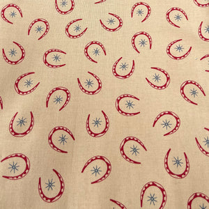 Rawhide by Moda Featuring Red Horseshoes and Blue Stars on Brown - 100% cotton Dressmaking Fabric - 42" x 94" *