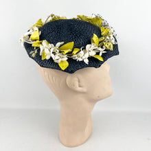 Load image into Gallery viewer, Original 1950’s Lacquered Raffia Hat with Flower Trim and Net in Navy, White and Yellow
