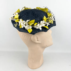 Original 1950’s Lacquered Raffia Hat with Flower Trim and Net in Navy, White and Yellow