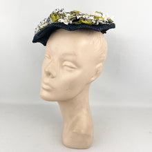 Load image into Gallery viewer, Original 1950’s Lacquered Raffia Hat with Flower Trim and Net in Navy, White and Yellow
