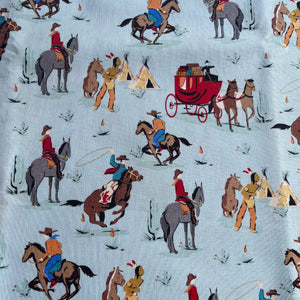 Cowboy Country by Riley Blake - Cowboy Themed Print with Horses and Wagons on Cream - 100% Cotton Dressmaking Fabric - 42" x 70"