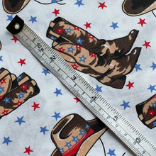 Load image into Gallery viewer, 100% Cotton Dressmaking Fabric - White with Cowboy Print in Brown, Red and Blue with Stars - 58&quot; x 38&quot;
