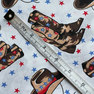 100% Cotton Dressmaking Fabric - White with Cowboy Print in Brown, Red and Blue with Stars - 58" x 38"
