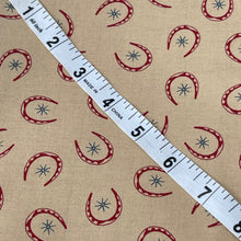 Load image into Gallery viewer, Rawhide by Moda Featuring Red Horseshoes and Blue Stars on Brown - 100% cotton Dressmaking Fabric - 42&quot; x 94&quot; *
