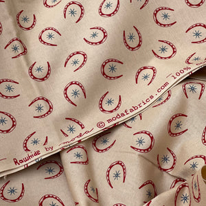 Rawhide by Moda Featuring Red Horseshoes and Blue Stars on Brown - 100% cotton Dressmaking Fabric - 42" x 94" *