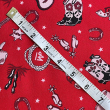 Load image into Gallery viewer, Alexander Henry Cowboy and Guitar Print Fabric in Red, Black and Pale Pink - 100% Cotton Dressmaking Fabric - 42&quot; x 80&quot;
