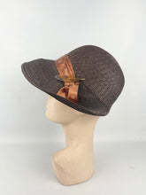 Load image into Gallery viewer, Original 1930s Brown Straw Cloche Hat with Rust Coloured Polka Dot Ribbon Trim and Metal Feather Trim
