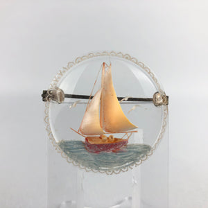 Original 1940s 1950s Circular Reverse Carved Lucite Brooch with Sailing Ship on the Sea