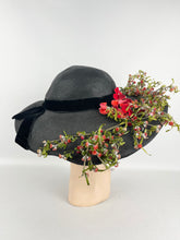 Load image into Gallery viewer, Absolutely Incredible Huge Black Straw Hat with Wonderful Flower Trim from the 1920&#39;s or 1930&#39;s *
