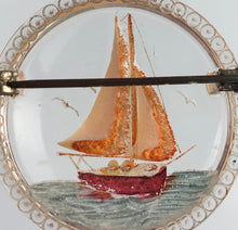Load image into Gallery viewer, Original 1940s 1950s Circular Reverse Carved Lucite Brooch with Sailing Ship on the Sea

