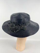 Load image into Gallery viewer, Original 1940&#39;s Dark Blue Lacquered Straw Hat with Net Covered Flower Trim by Peter Robinson *
